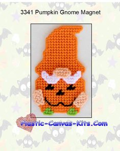 an orange crocheted pumpkin with a hat on it's head is shown