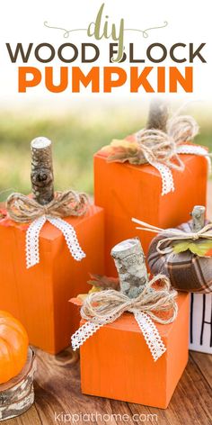 orange 4x4 scrap wood pumpkins with stick stems, twine bow and lace tie on a wood table 4x4 Wood Pumpkins Diy, 4 By 4 Wood Crafts, Easy Fall Wood Crafts Diy, Square Wood Pumpkins Diy, Wood Square Crafts Diy Projects, 4x4 Pumpkins Diy, Wood Pumpkins Diy Fall Crafts, 4x4 Pumpkins, Wood Block Pumpkins