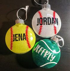 three personalized christmas ornaments with baseballs on each ornament, one is green and the other is yellow