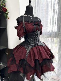 a mannequin is dressed in red and black