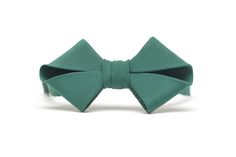 MASAMI is a bow tie made entirely by hand in very high quality silk, 100% Made in Italy. It is a registered design due to its unusual shape. Every detail is well finished and cared for. The metalwork of the hook is also of excellent quality. Its shape takes inspiration from the folds of Japanese origami which determine a surprising geometry. It is structured and soft together due to the choice of silk used. A truly unique contrast. It takes many hours of work, around 8 and over 60 steps to make Classic Green Bow Tie For Business, Elegant Green Tie With Satin Bow, Adjustable Green Bow Tie For Formal Occasions, Classic Green Tie With Satin Bow, Classic Green Bow Tie For Formal Occasions, Elegant Green Tie With Bow Detail, Classic Adjustable Green Bow Tie, Classic Green Bow Tie For Gifts, Green Bow Tie For Business