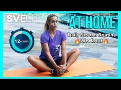 a woman sitting on top of a yoga mat in front of an at home timer