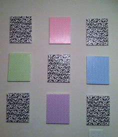 six square pieces of paper are arranged on the wall