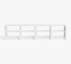 a white shelf with three shelves on each side