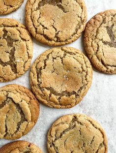 chocolate chip cookies on a baking sheet lined with parchment paper, ready to be eaten