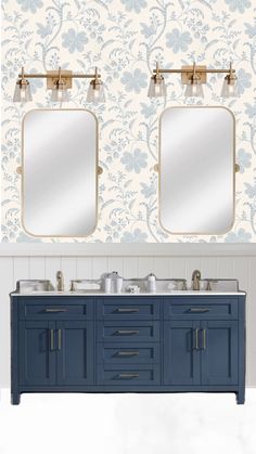 a bathroom with two sinks and mirrors on the wall, in front of a blue floral wallpaper