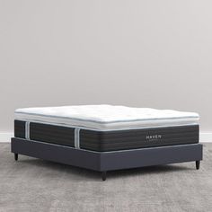 the haven mattress is on display in front of a gray wall and carpeted floor