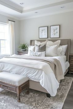 a large bed sitting in a bedroom next to a window