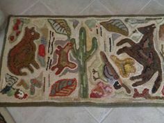 a rug with animals and plants on it