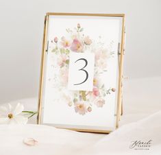 a table number with flowers on it