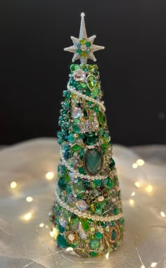 a small christmas tree made out of beads