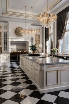 an elegant kitchen with black and white checkered flooring, chandeliers and cabinets