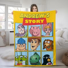 there is a woman holding up a poster with cartoon characters on it and the words andrews's story