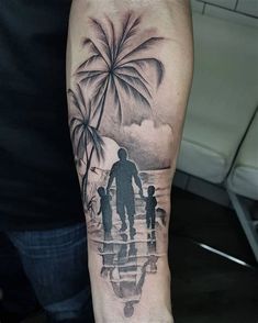 a man's arm with an image of a family and palm trees on it