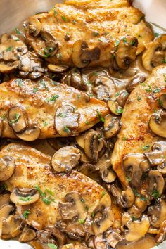 chicken with mushrooms and parsley in a skillet