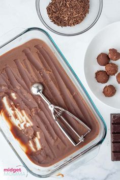 chocolate ice cream in a glass dish with spoons next to it and other ingredients