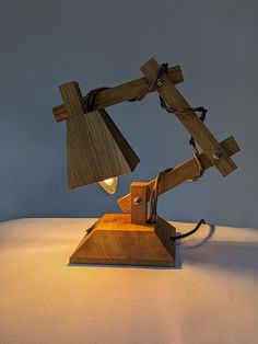 a desk lamp made out of wooden planks