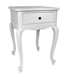 a small white table with drawers on one side and an open drawer on the other