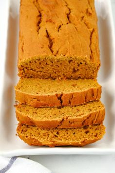 sliced loaf of pumpkin bread on a white plate