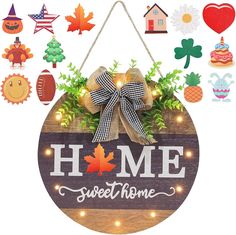 a wooden sign that says home sweet home surrounded by fall decorations and magnets on the wall