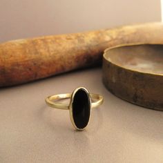 The Ring Made From 14 Karats Solid Yellow Gold. Ring Width 0.06inch/ 1.5mm. 1 Natural Black Onyx 0.23x0.47inch/ 6x12mm. Ring For Women. Beautiful Gold Ring Bezel Set With Black Onyx. A Classic Ring For Women. Available In All Sizes, Color, Gold, And Karat And Matte Or Shining Finish. If You Want To Change Something, Stone, Width, Personal Engraving, Or Anything Else. Please Contact Me, And I Will Build The Dream Ring You Want. If You Want A Custom Ring Please Contact Me Before Purchase. Timeless Black Stackable Jewelry, Fine Jewelry Black Stackable Rings, Black Stackable Rings Fine Jewelry, Black Stackable Fine Jewelry Rings, Classic Black Stackable Jewelry, Fine Jewelry Yellow Gold Onyx Rings, Yellow Gold Black Spinel Rings For Gift, Fine Jewelry Yellow Gold Rings With Onyx, Minimalist Yellow Gold Jewelry With Black Spinel