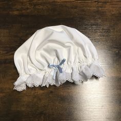 "Your favorite prairie/colonial day/night cap now available with a dainty colored bow! These caps are perfect to keep your hair out of your way well sleeping, keeping warm and creating a historic look. Cap comes with your choice of fabric ruffle, lace, or plain edge.  The sizing for age and/or head circumference: Doll: 10-13 inch circumference, most 18\" dolls. Small: Ages 3-7 years |  Head circumference 20 1/2 -21 inches 52-56 centimeters Medium: Ages 6-16 years (small adult) Head circumference Sleeping Cap, Elf Cap, Victorian Maid, Red Stockings, Stocking Cap, Hair Bonnet, Baby Bonnets, Night Cap, Pirate Costume