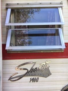 an old camper with the word shelta painted on it's side