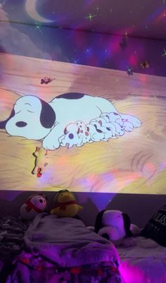 a child's bedroom with a dog on the wall and stars in the ceiling