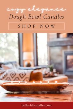 a wooden tray with candles on it in front of a fire place and the words dough bowl candles shop now