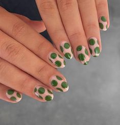 Add a pop of fun to your nails with this youthful design of green polka dots on a neutral backdrop. Get the look: NO. 034 ROYAL HUNTER GREEN, NO. 032 CAMEL TAN Inspiration: peachinails on Instagram Nails Polish Colors, Polka Dot Nail Art Designs, Olive Green Nails, Checkered Nails, Dot Nail Designs, 2023 Nail, Dot Nail Art, Green Nail Designs, Polka Dot Nails