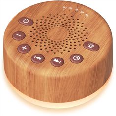 the wooden speaker is made from wood and has buttons