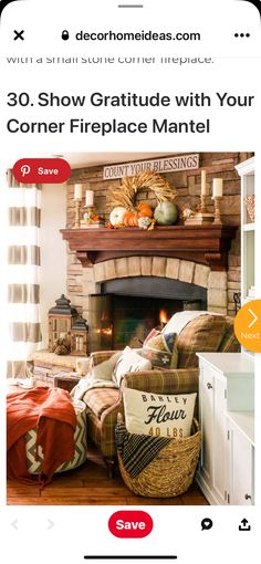 a fire place that is in the middle of a room with pillows and blankets on it