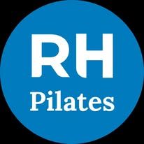 a blue circle with the words rh pilates in white letters on it