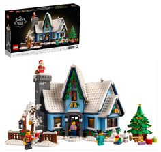 a lego christmas house is shown in front of the box