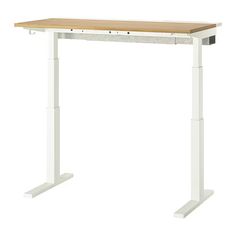 a computer desk with a wooden top and white metal legs on an isolated white background