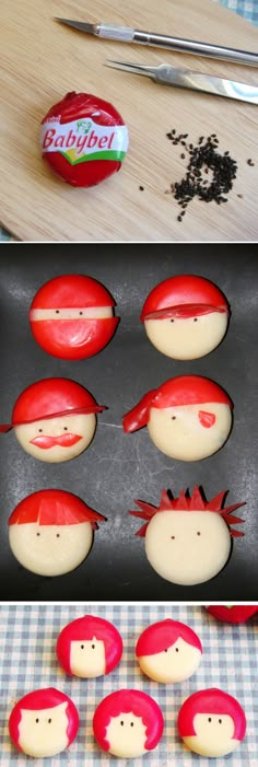 some red and white cookies with different faces on top of each cookie tinker tray