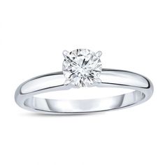 a white gold engagement ring with a round diamond in the center and a thin band