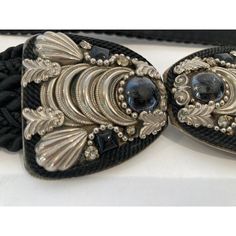 Judith Leiber Black Belt with Silver and Black Stones bubble Buckle. black cotton silk velvet waist belt. Categories : Women Category: Accessories Sub-category: Belts Material: Cotton Color: Black Buckle is 2" H x 4 " wide. Total Length 25 inches. Known for her amazing purses, Judith Leiber’s creativity continued with accessories such as this beautiful estate adjustable belt from the 1980s with semi-precious stone-studded. Hungarian born Judith Leiber (1921-2018) was known as the handbag designe Adjustable Black Evening Belt, Formal Black Embroidered Belt, Vintage Black Adjustable Belt, Designer Adjustable Black Belt, Designer Party Belts, Elegant Black Belt For Evening, Chic Black Belt For Evening, Black Embroidered Belt For Party, Party Black Embroidered Belt