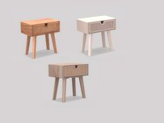 three small wooden tables with drawers on one side and an open drawer on the other