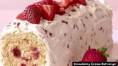 a close up of a cake with strawberries on top