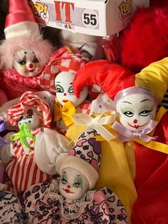 many clown dolls are on display for sale