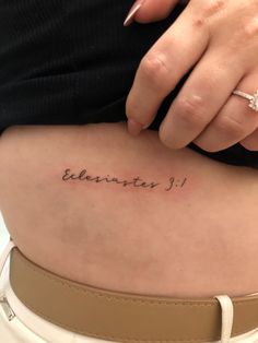 a woman's lower back tattoo with the word elevaster on it