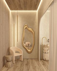 the interior of a modern bathroom with wood flooring and gold mirror on the wall