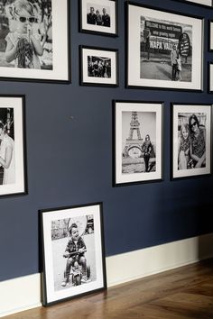 black and white photographs are hanging on the wall