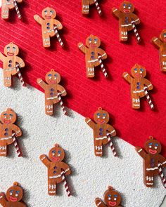 gingerbread cutouts are arranged on a red and white background