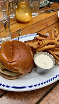 a plate with a sandwich and french fries on it