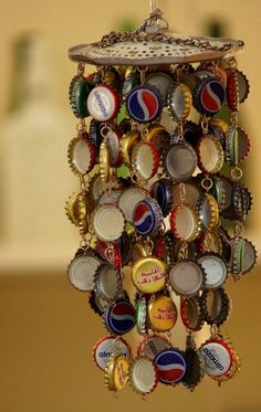 a bottle cap chandelier hanging from a ceiling