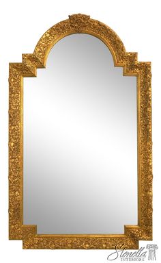 an ornate gold framed mirror on a white background