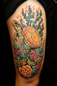 a woman's thigh with a turtle and flowers on it