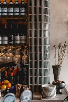 the shelves are filled with many bottles and glasses on top of each other in front of them